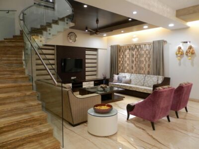 Modern luxury home interior with marble flooring and a glass staircase, representing the high-end real estate markets served by Carolyn Jenkins Blue in the Carolinas