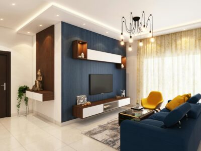 A modern living room featuring a navy blue slatted accent wall, a mid-century yellow armchair, and a sleek entertainment center, representing the contemporary Wilmington properties handled by Derrick Blanks II.